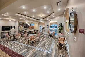 A modern dining and kitchen area with stylish decor and warm lighting.