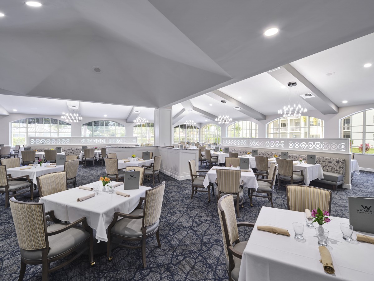 Elegant and spacious dining area with bright lighting and modern decor.