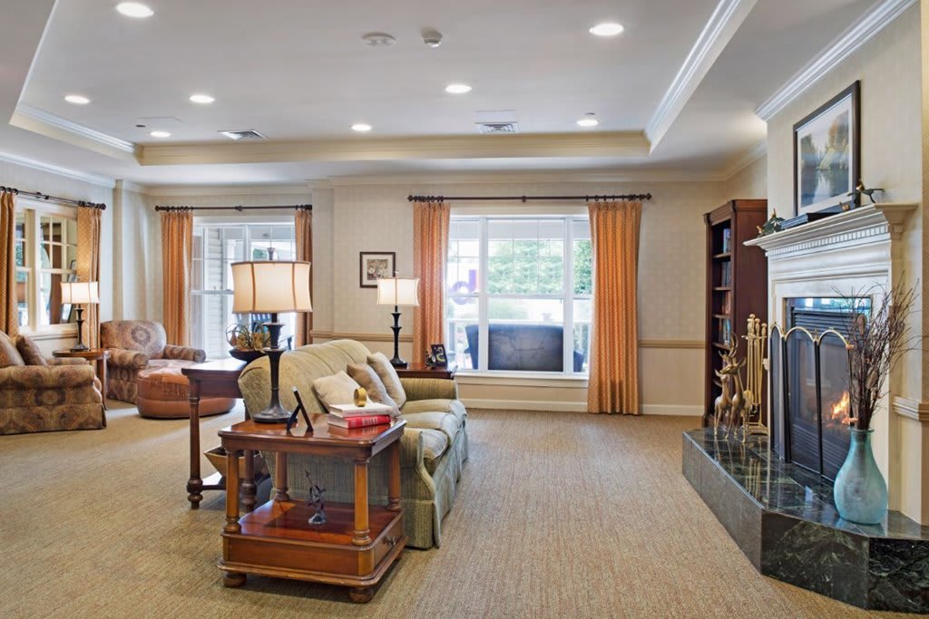 A cozy living room with elegant furniture and warm lighting.