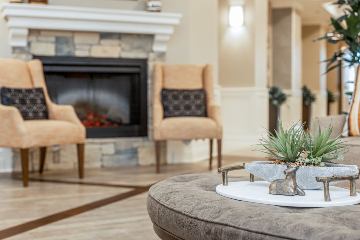 A cozy living room with a fireplace and stylish seating.