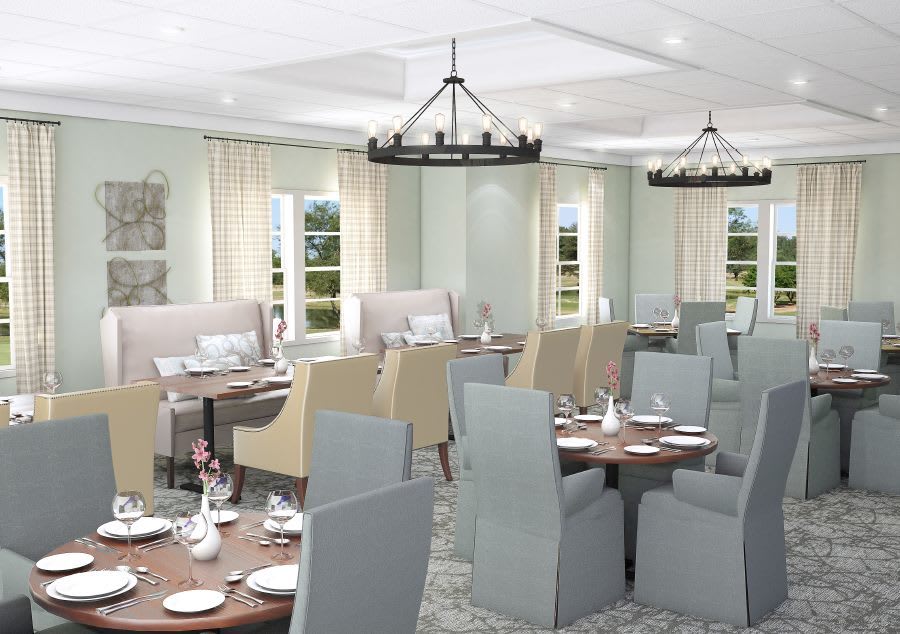 Elegant dining room with neatly arranged tables and comfortable seating.