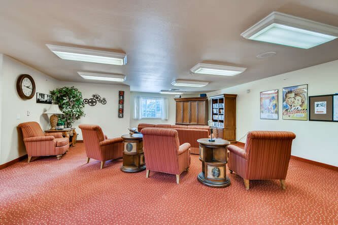 A cozy lounge area with comfortable seating and warm lighting.
