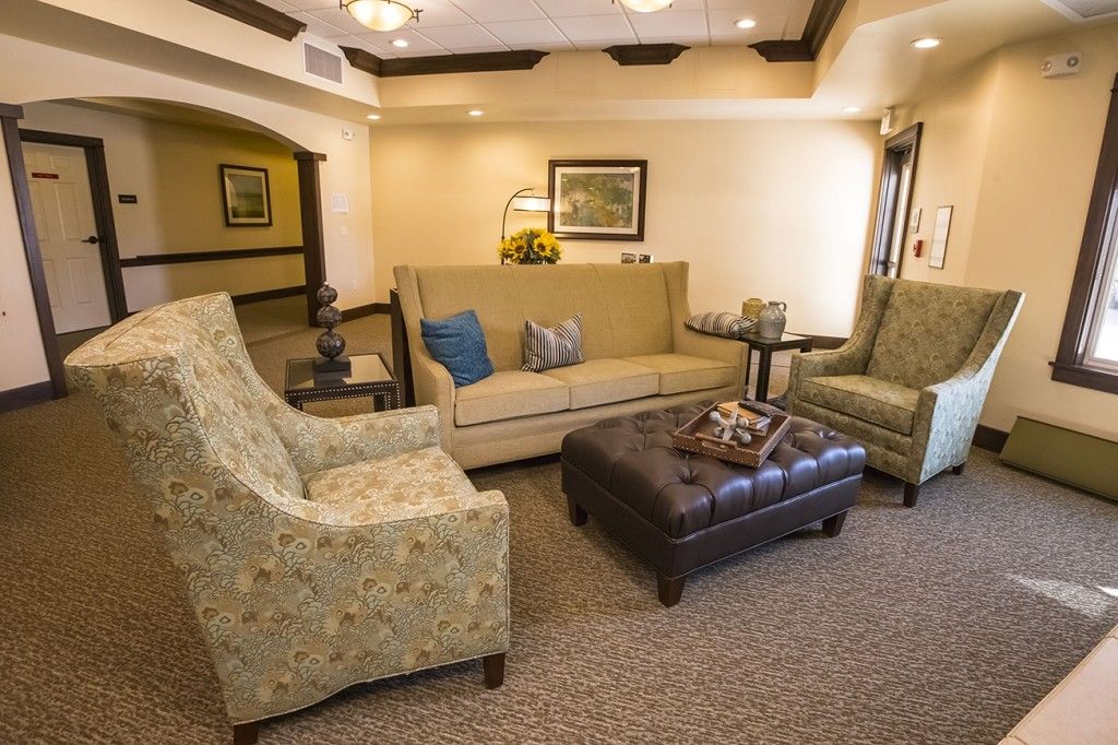 A cozy living room with comfortable seating and elegant decor.