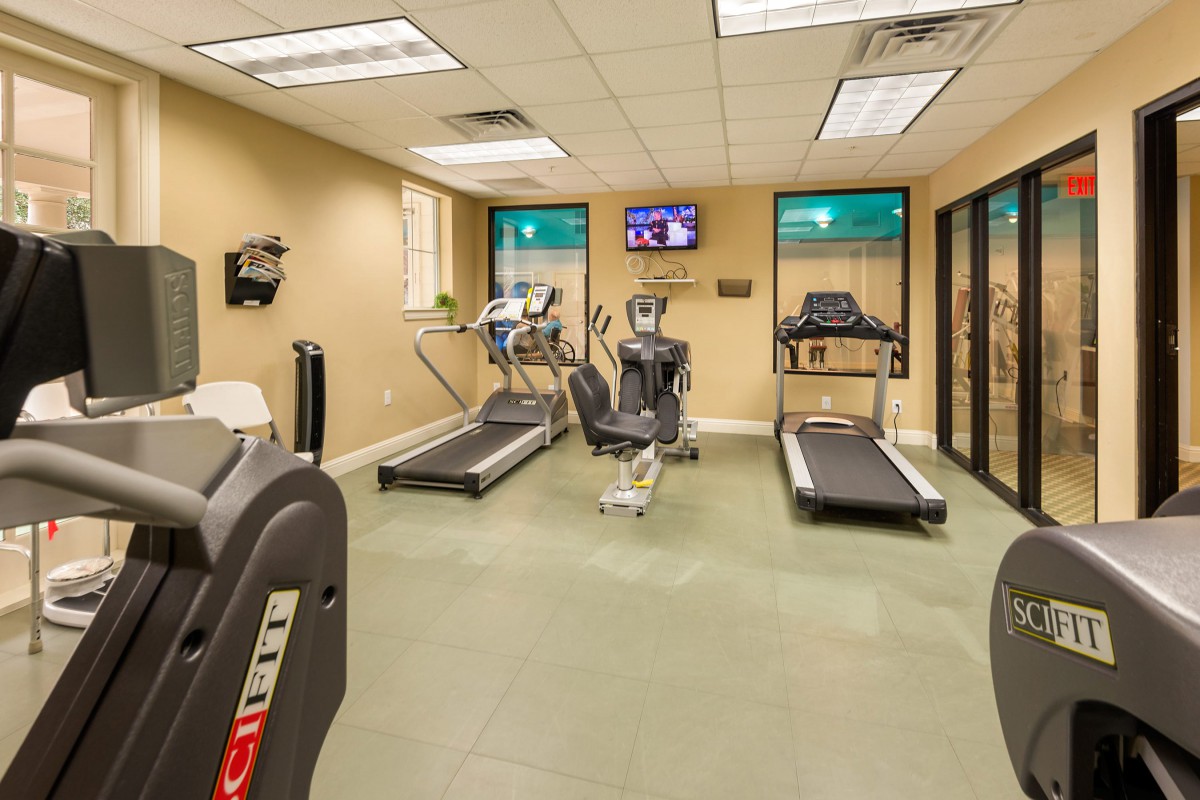 A small indoor gym featuring treadmills and a stationary bike.