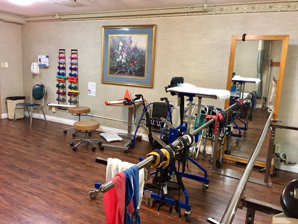 A physical therapy room equipped with various rehabilitation tools and exercise machines.