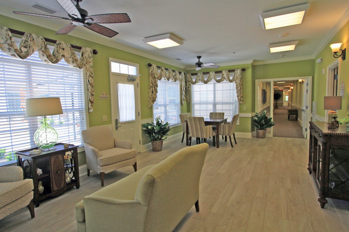 A cozy living and dining area with elegant decor and natural light.