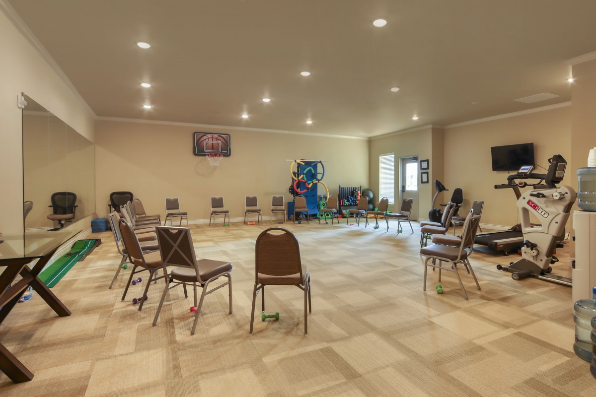 A spacious meeting room with chairs arranged in a circle.