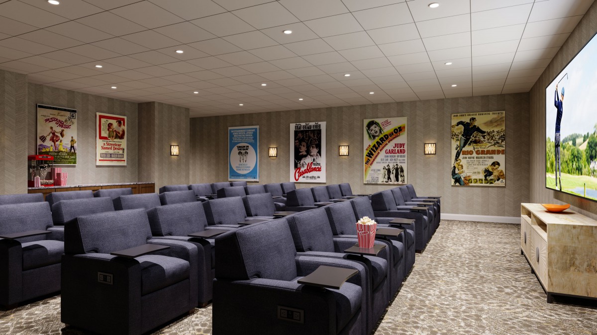 Cozy home theater with plush seating and classic movie posters on the walls.