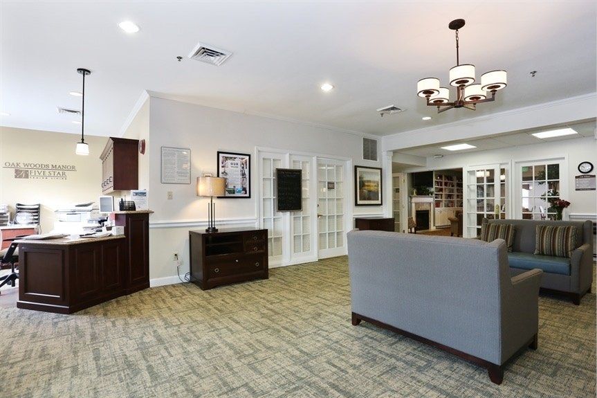 A modern living room with elegant furniture and lighting.