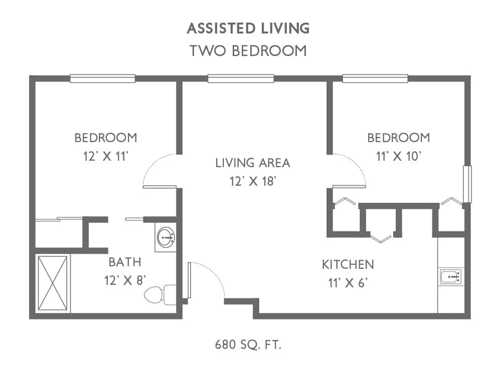 Floor plan of a two-bedroom assisted living unit, featuring a living area, kitchen, and bath.