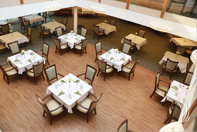 An aerial view of a restaurant dining area with neatly arranged tables and chairs.