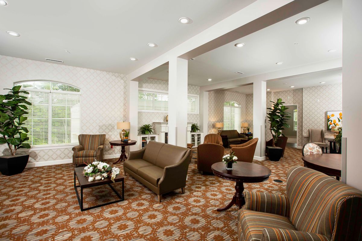 A bright, spacious lounge area featuring comfortable seating and elegant decor.