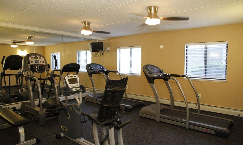 A well-equipped gym with treadmills and exercise bikes.