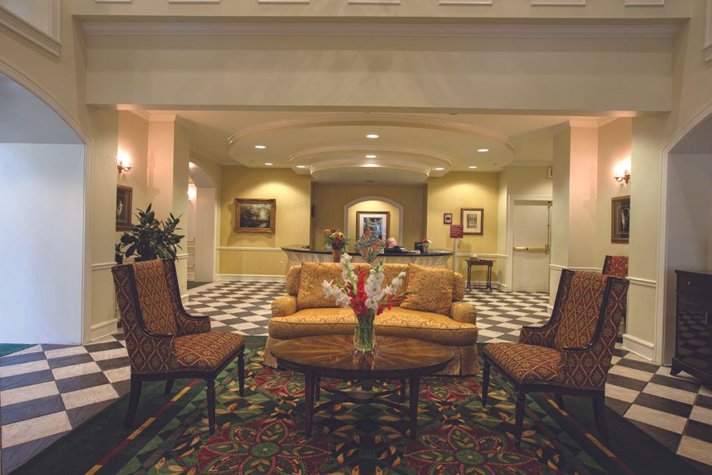 A cozy hotel lobby with elegant seating and warm lighting.