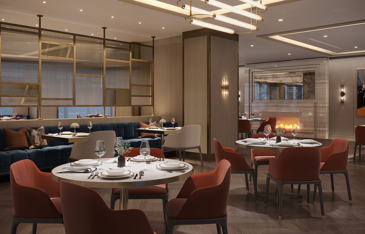 A modern restaurant interior featuring elegant lighting and a cozy dining area.