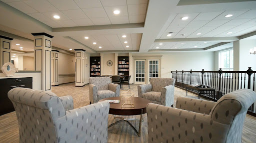 A contemporary lounge area with comfortable seating and warm lighting.