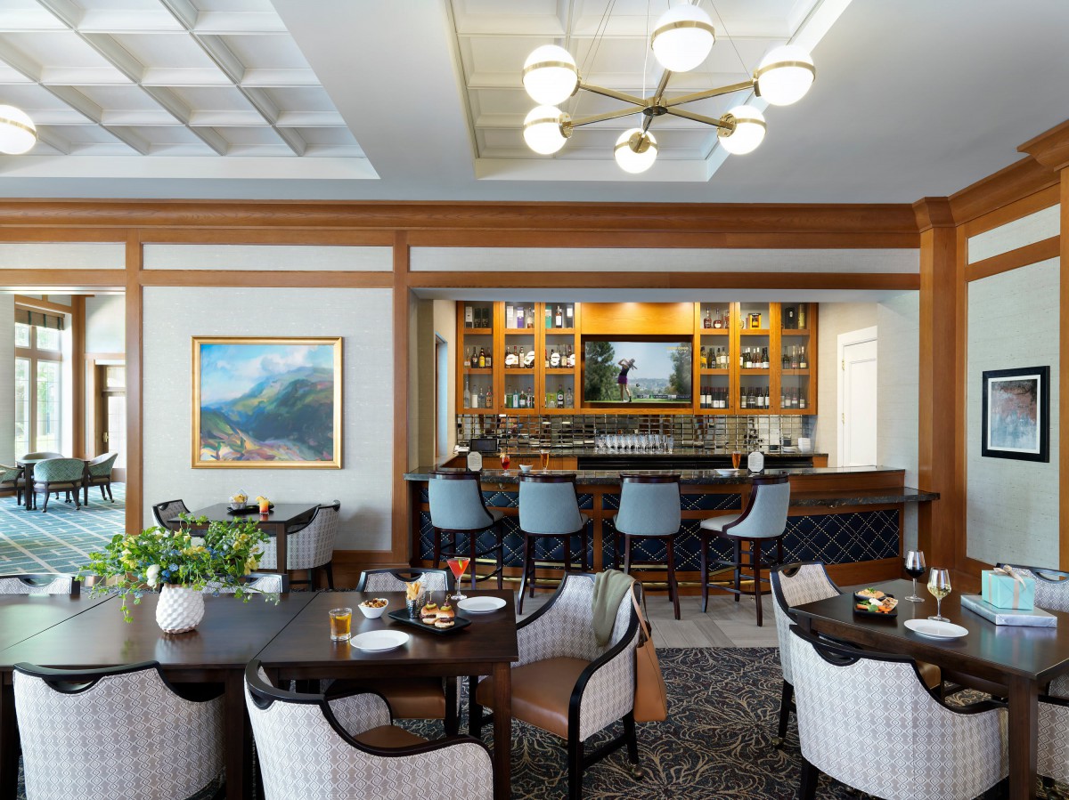 A stylish and modern bar lounge with comfortable seating and elegant decor.