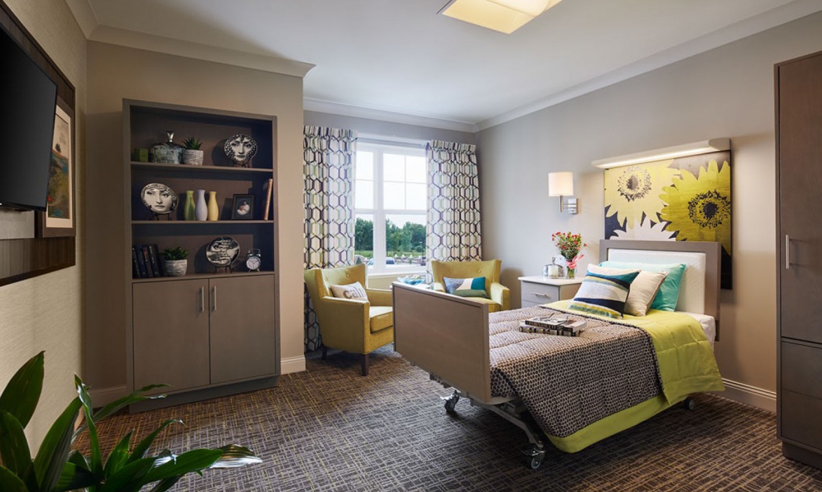 A cozy modern bedroom with a hospital bed and stylish interior decor.