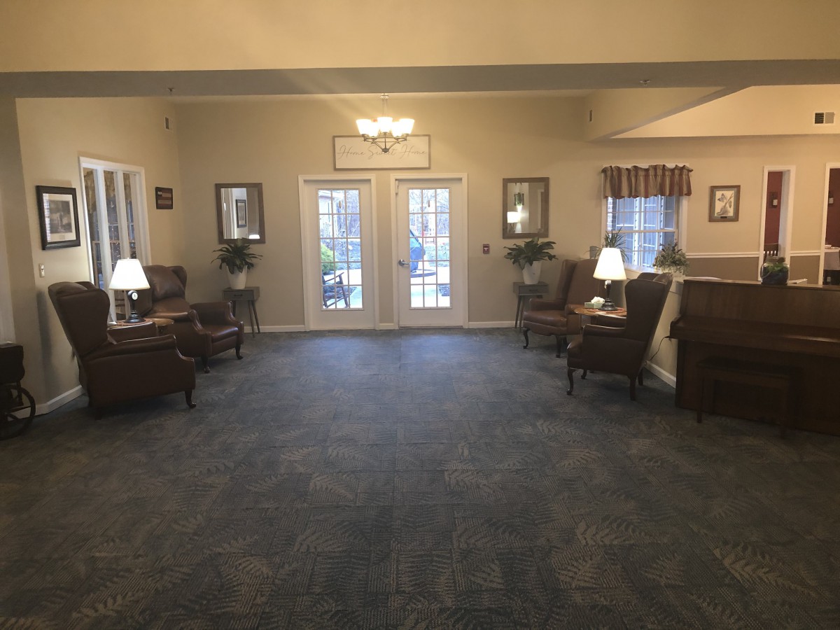 A spacious lobby area with comfortable seating and soft lighting.