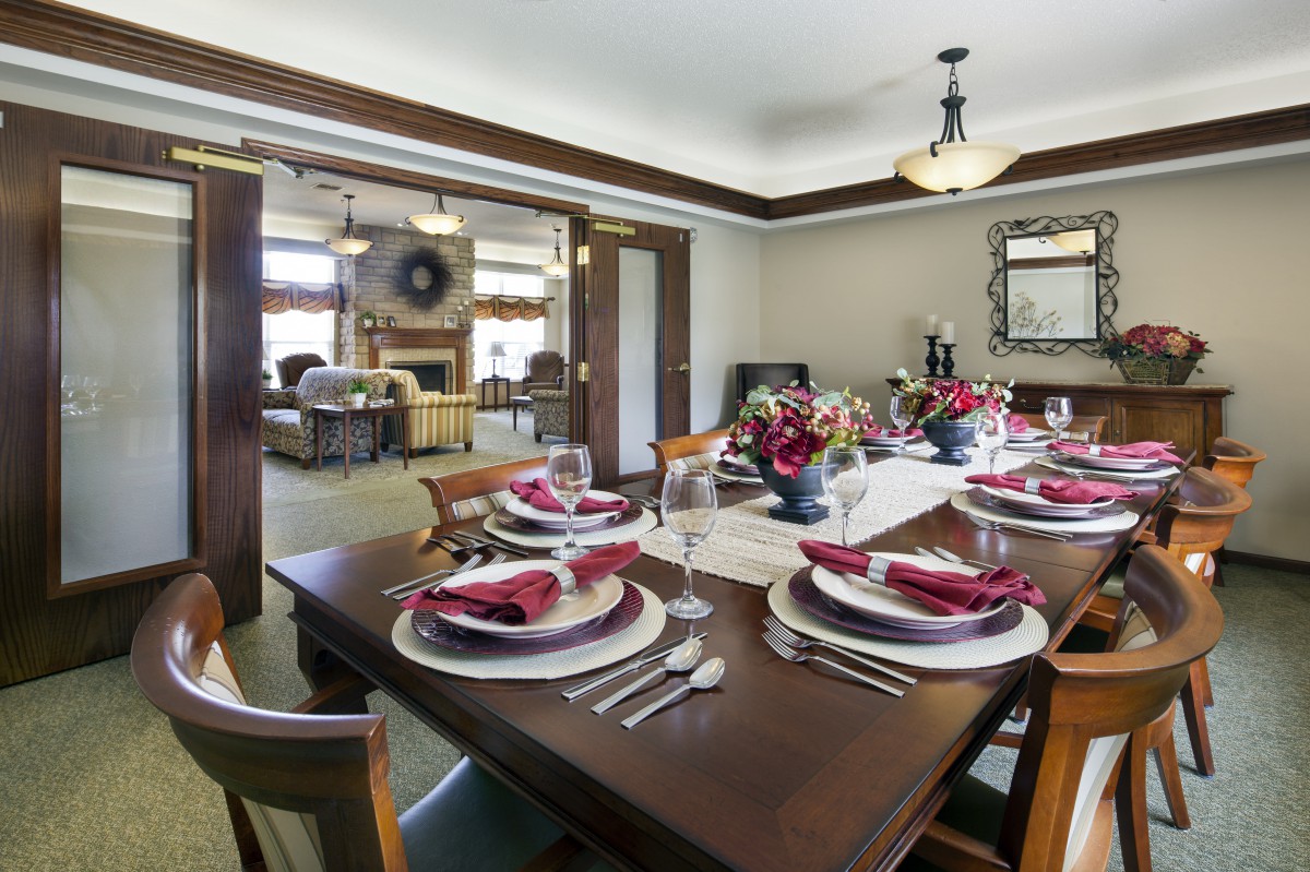 An elegantly set dining table in a well-decorated home interior.