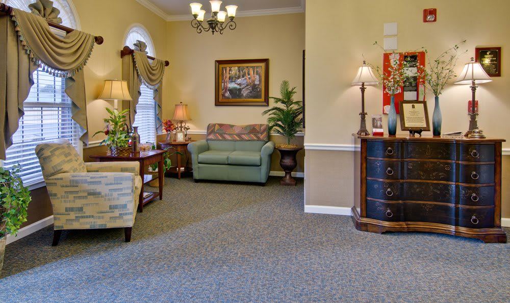 A cozy living room with comfortable seating and elegant decor.
