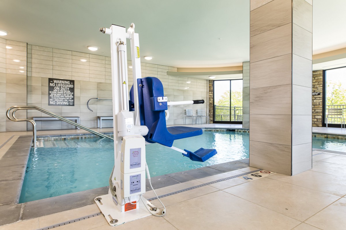 An indoor pool equipped with an accessibility lift for easy access.