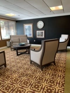 A cozy waiting room with comfortable seating and stylish decor.