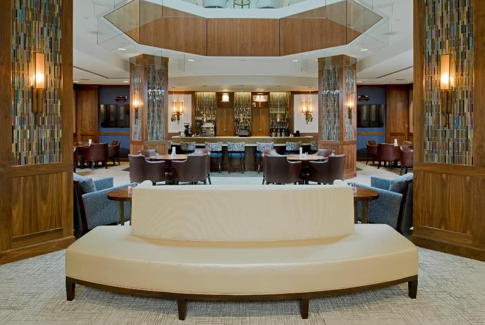 A modern and luxurious lounge interior with elegant seating arrangements.