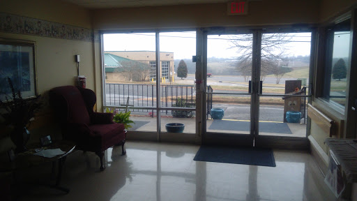 A view of the lobby with large windows showcasing the outside environment.