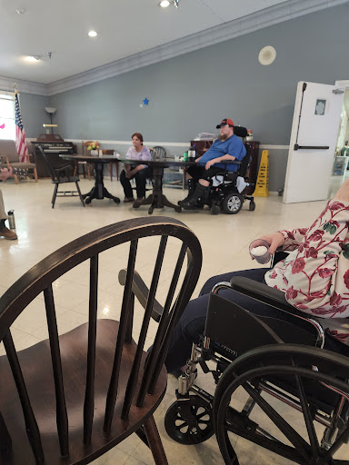 Residents engaging in activities in a senior living facility.