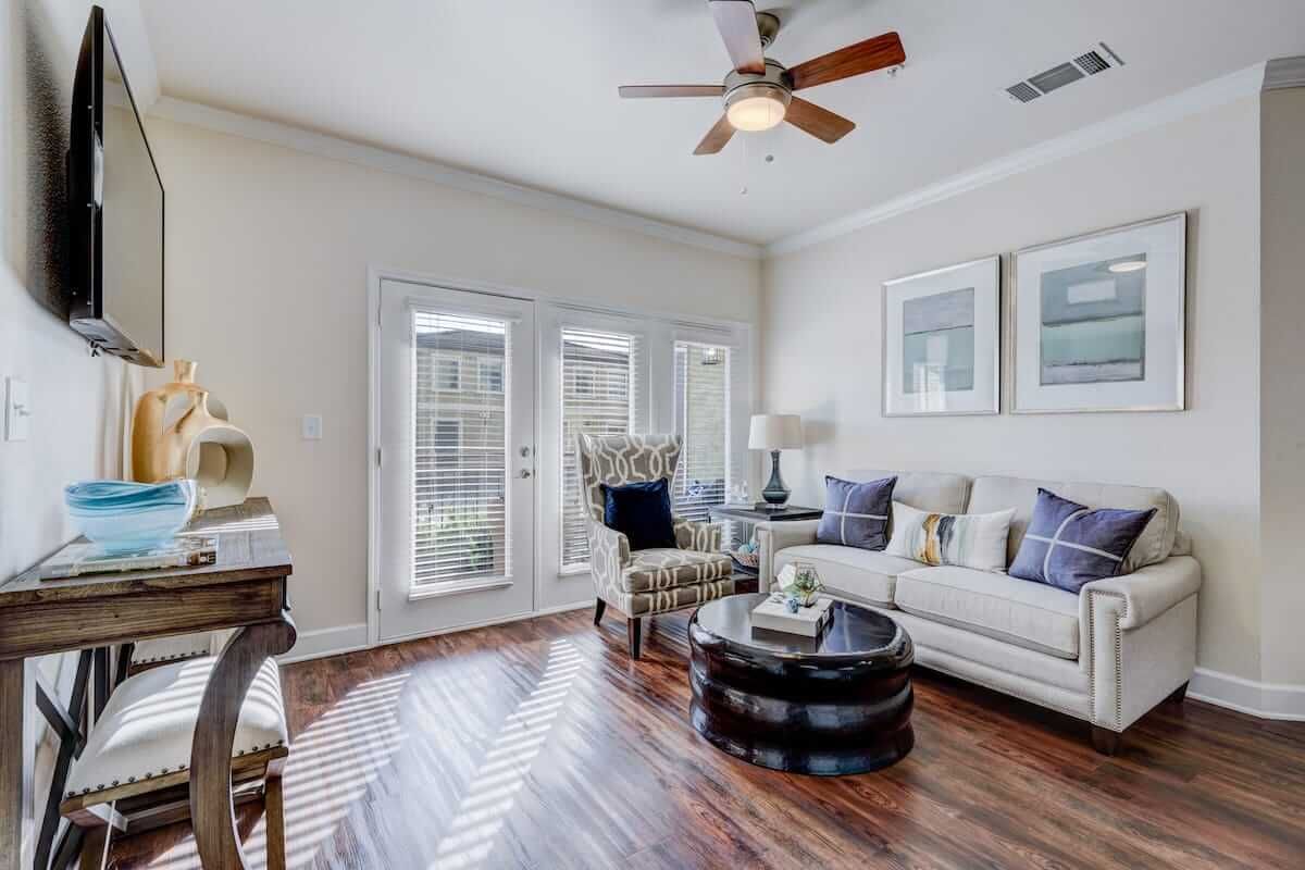 A stylish living room featuring a comfortable sofa, elegant coffee table, and tasteful decor.