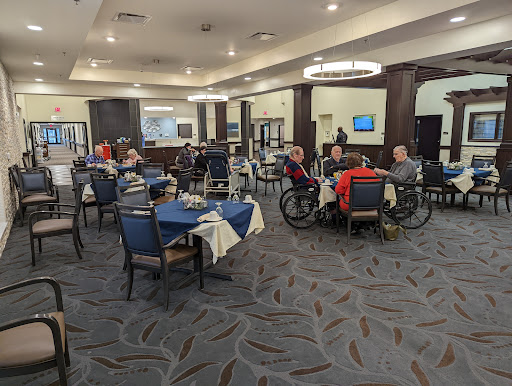 A bustling dining area with several patrons enjoying their meals in a comfortable setting.