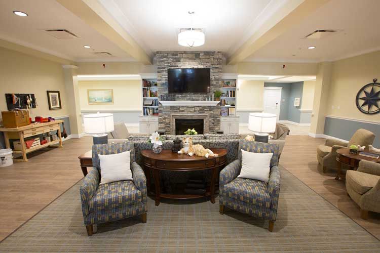 A cozy living room with a fireplace, television, and comfortable seating.
