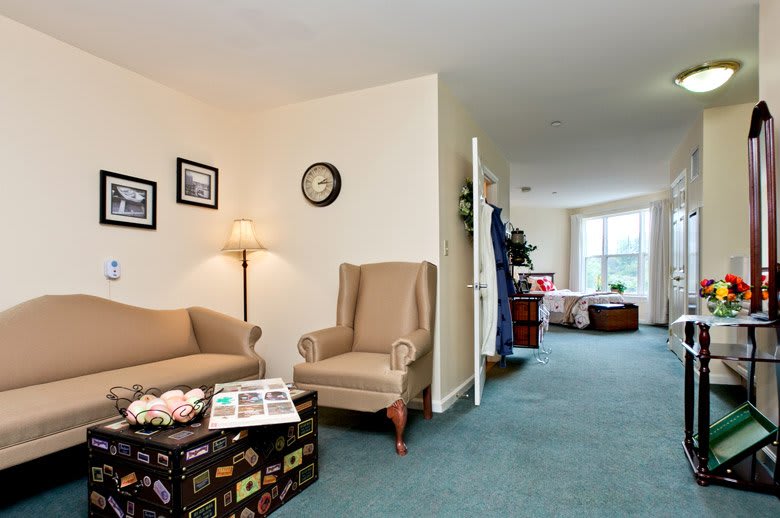 A cozy living room with comfortable seating and warm lighting.