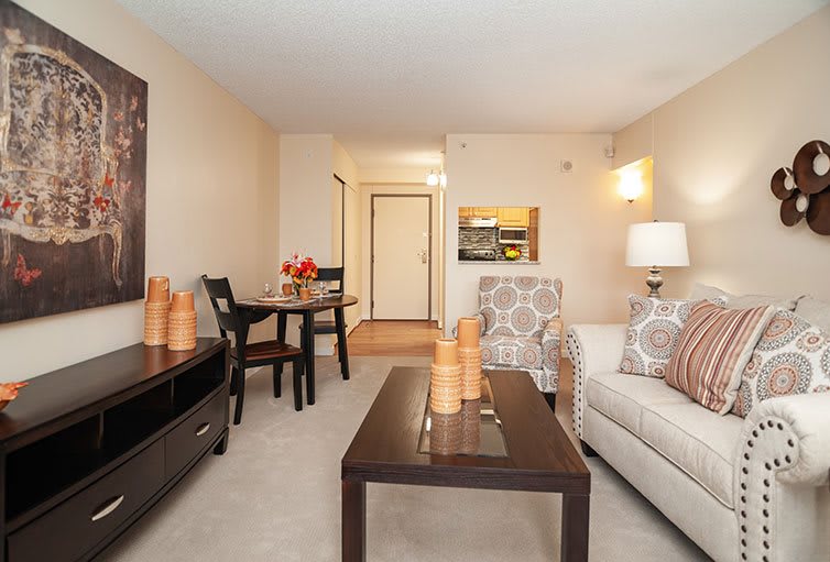 A cozy living and dining area with modern furniture and decor.