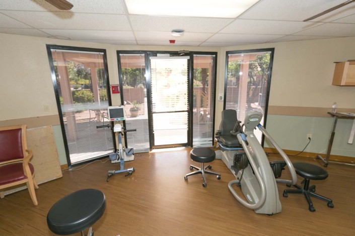 A dental office waiting area with dental equipment and chairs.