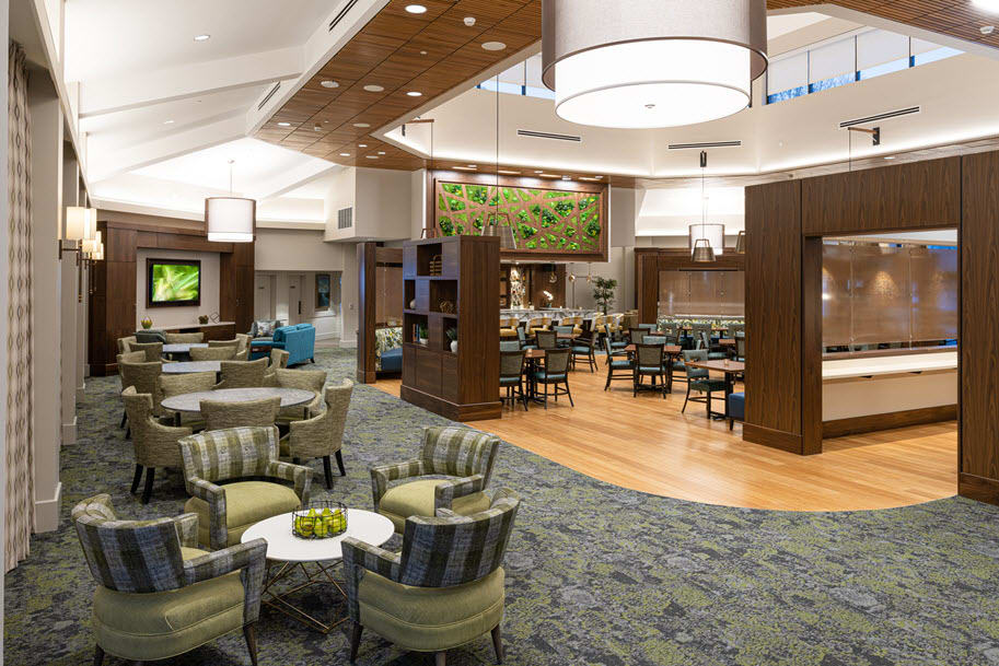 A spacious, modern lounge with comfortable seating and stylish lighting.
