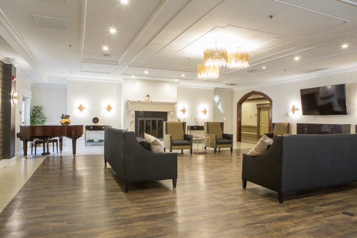 A spacious and elegantly decorated lobby with modern furnishings and lighting.