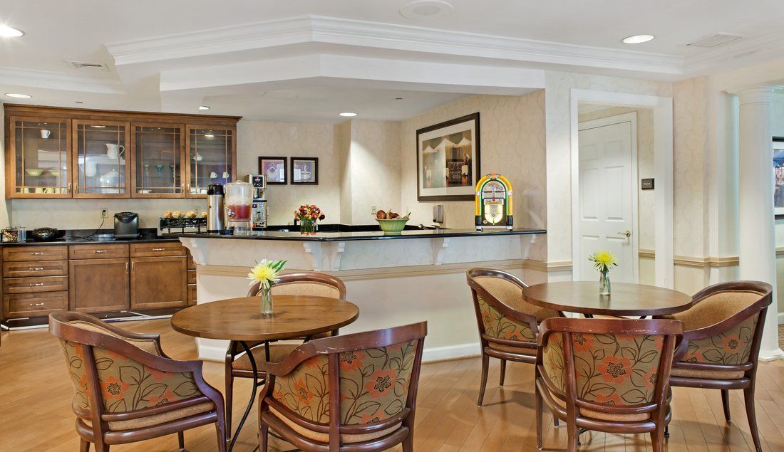 Elegant hotel lobby with seating area and reception desk.