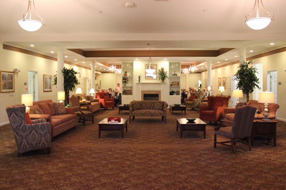 A cozy lobby with comfortable seating and warm lighting.