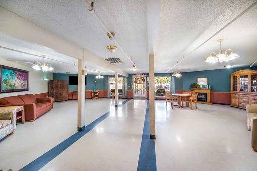 A spacious community lounge featuring comfortable seating and ample natural light.