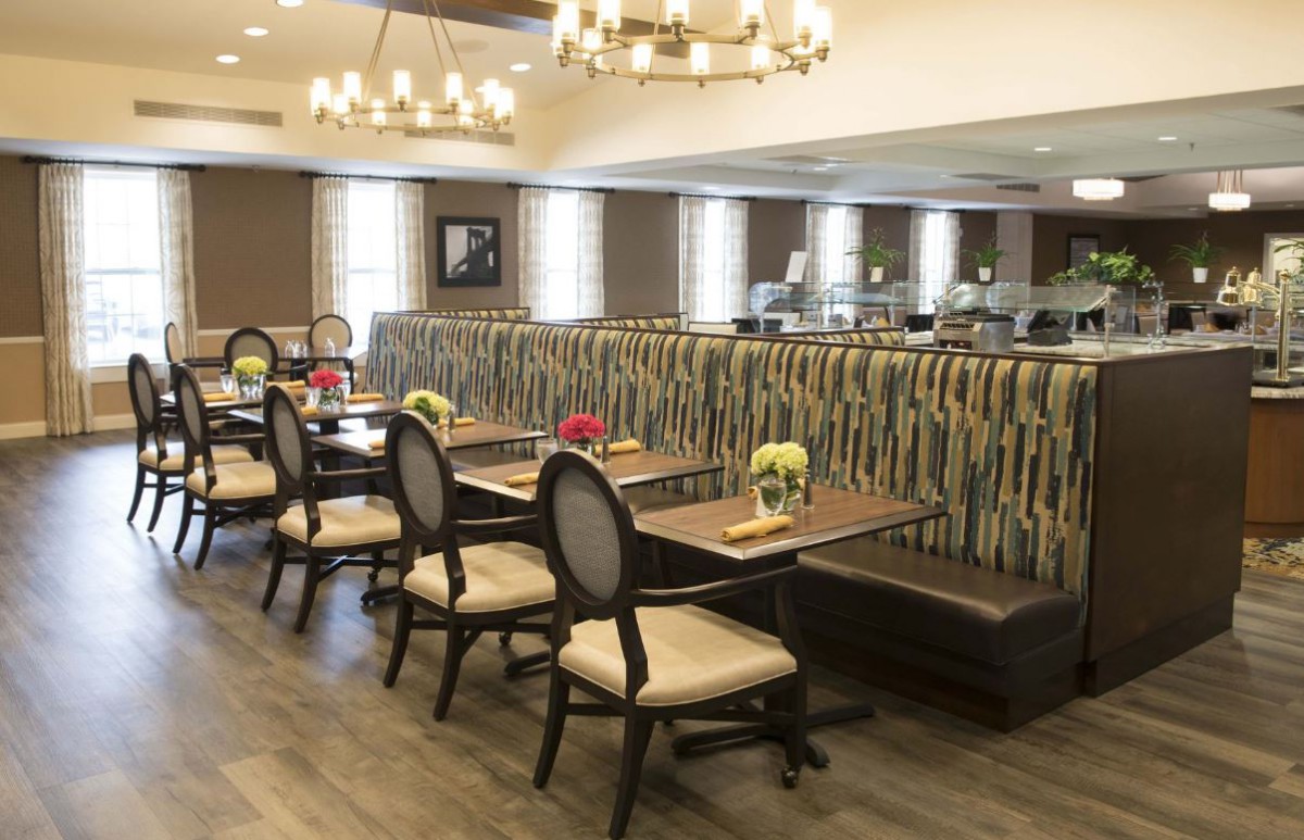 A well-decorated dining area with elegant seating and ambient lighting.