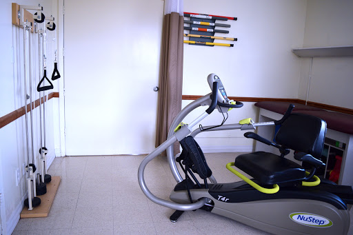 A piece of exercise equipment set up in a room, ideal for fitness training or rehabilitation.