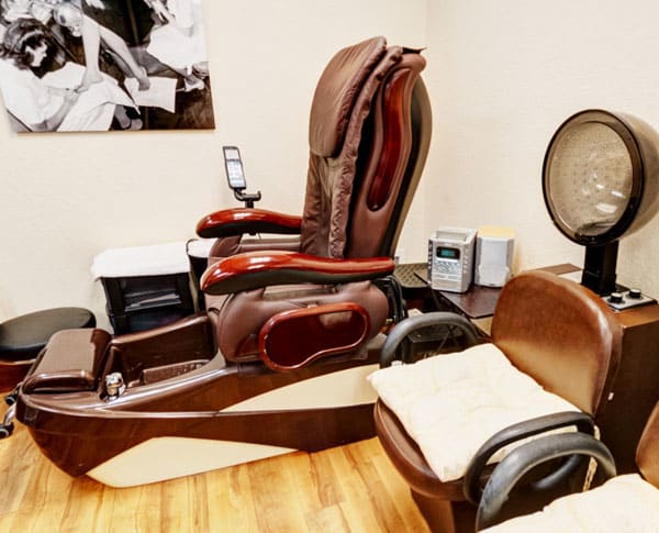 A comfortable pedicure chair setup in a spa or salon.