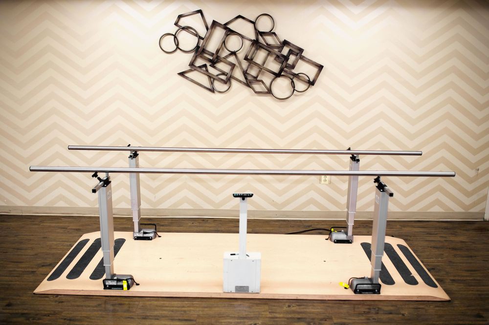 A set of parallel bars used for physical therapy and rehabilitation.