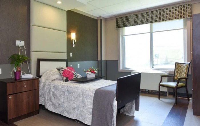 A modern and comfortable bedroom with ample natural light.