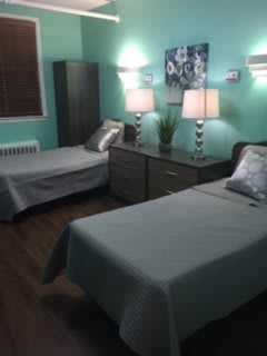 A cozy bedroom with twin beds and stylish decor.