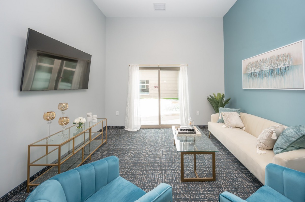 A modern living room with elegant furniture and minimalist decor.
