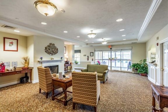 A cozy living room with comfortable seating and warm lighting.