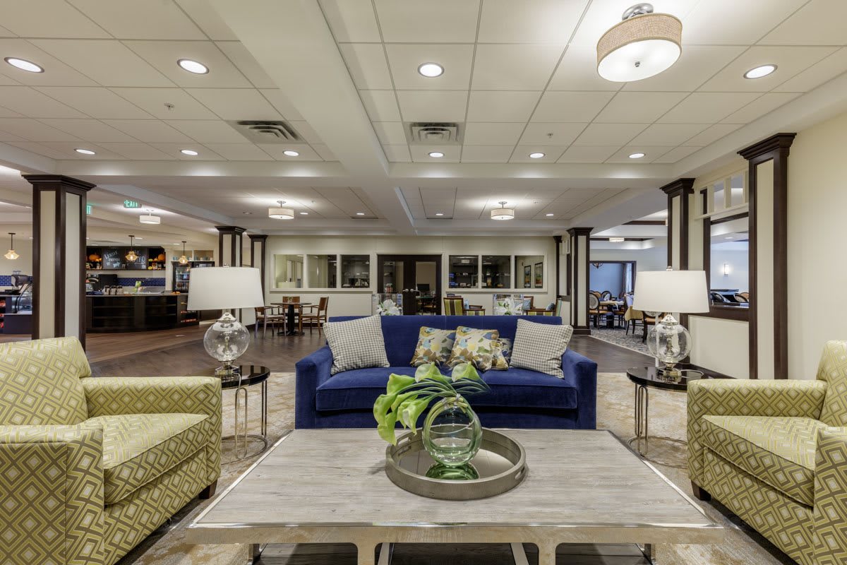 A spacious lobby area featuring comfortable seating and stylish interior decor.